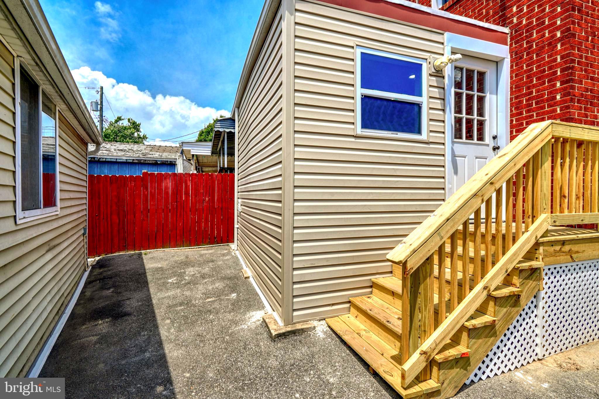 8341 Kavanagh Road Dundalk, MD 21222 - Photo 7 of 61 SMALL ENTERTAINING PATIO BETWEEN HOUSE @ GARAGE