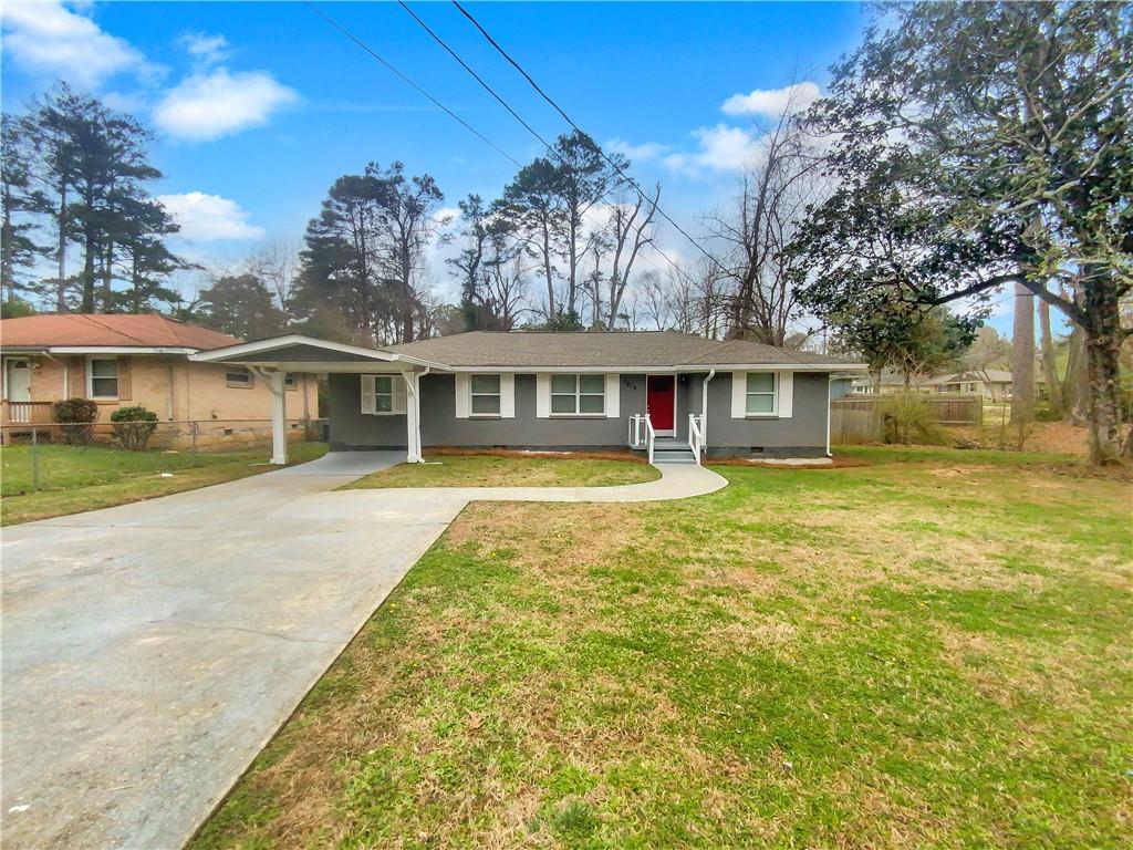 1819 Rosewood Road Decatur, GA 30032 - Photo 1 of 1 front view of a house with a yard