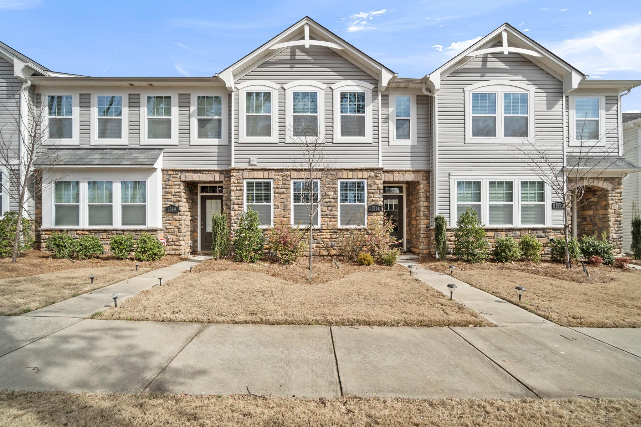 1564 Galloway Road Charlotte, NC 28262 - Photo 1 of 37 a front view of a building with a yard