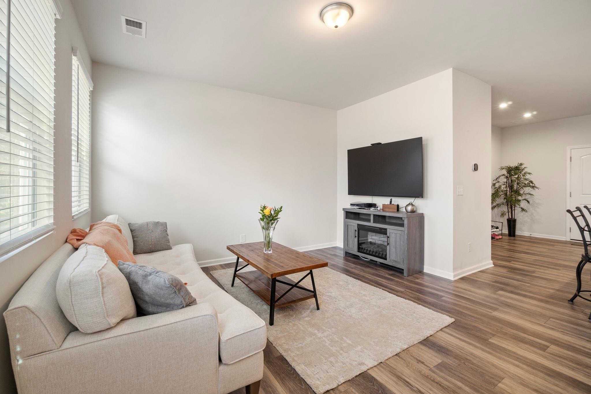 1564 Galloway Road Charlotte, NC 28262 - Photo 12 of 37 a living room with furniture and a flat screen tv