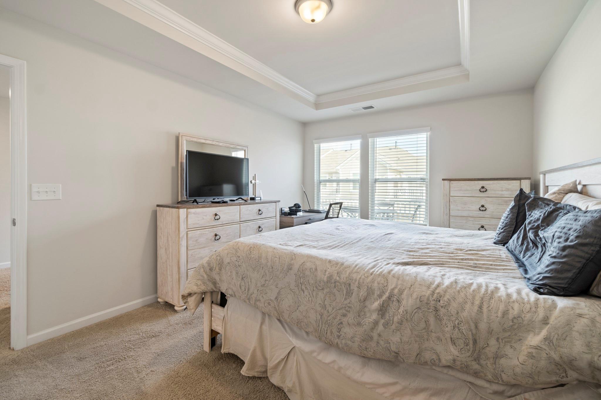1564 Galloway Road Charlotte, NC 28262 - Photo 20 of 37 a bedroom with a bed and a flat screen tv