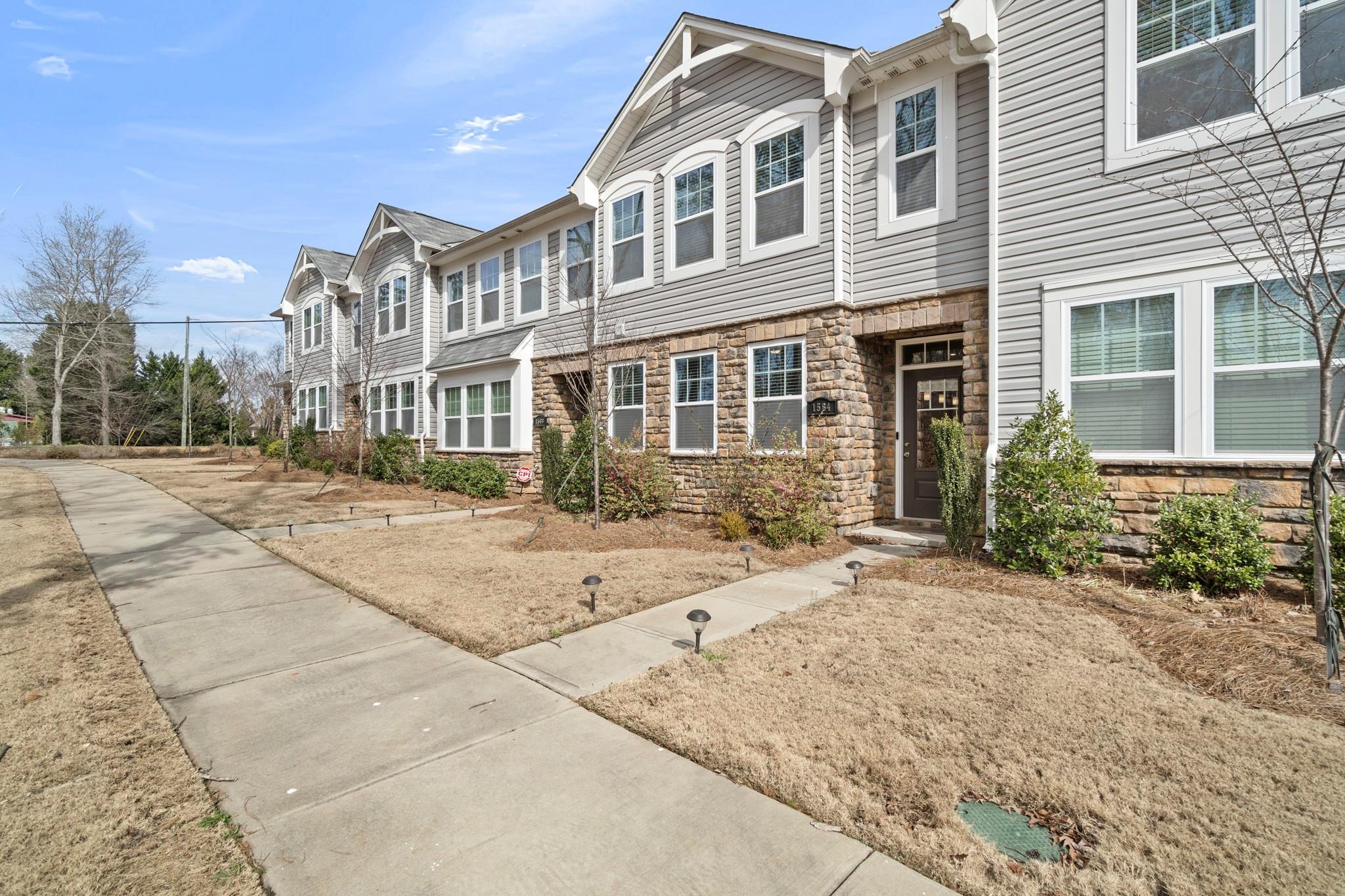 1564 Galloway Road Charlotte, NC 28262 - Photo 2 of 37 a front view of a building with a garden and plants