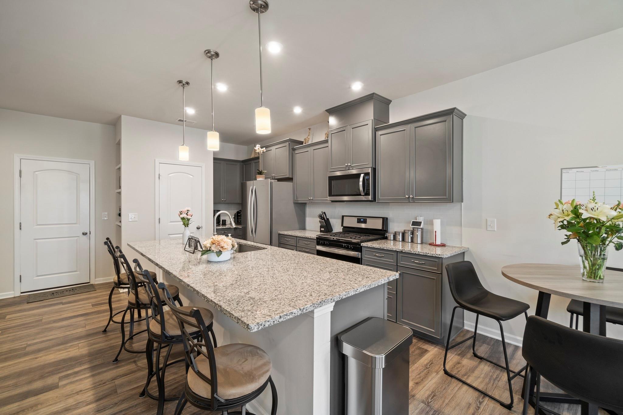 1564 Galloway Road Charlotte, NC 28262 - Photo 8 of 37 a kitchen with granite countertop white cabinets and stainless steel appliances