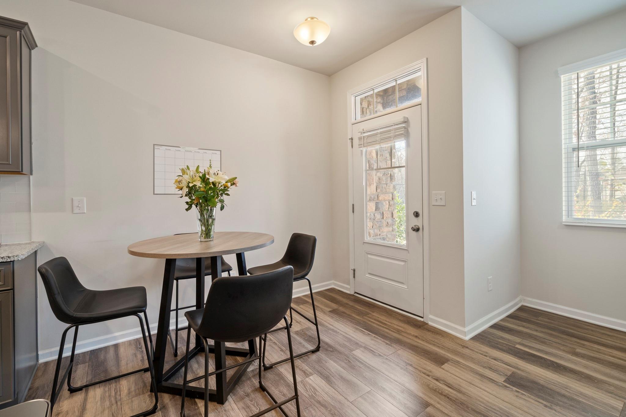 1564 Galloway Road Charlotte, NC 28262 - Photo 10 of 37 a view of a dining room with furniture and wooden floor