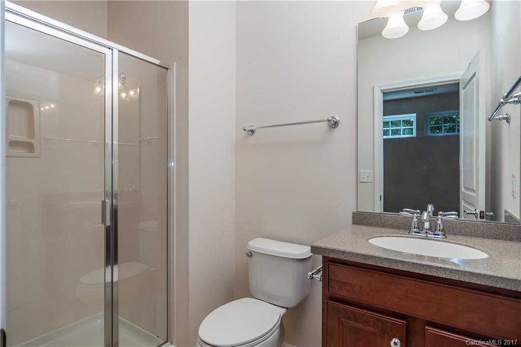 916 Lyndley Drive Fort Mill, SC 29708 - Photo 11 of 21 a bathroom with a granite countertop sink toilet and shower