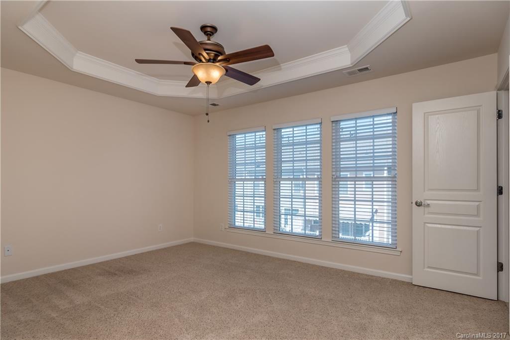 916 Lyndley Drive Fort Mill, SC 29708 - Photo 15 of 21 an empty room with a ceiling fan and window