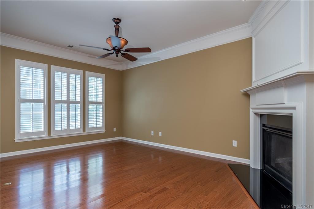 916 Lyndley Drive Fort Mill, SC 29708 - Photo 3 of 21 a view of an empty room with window and wooden floor