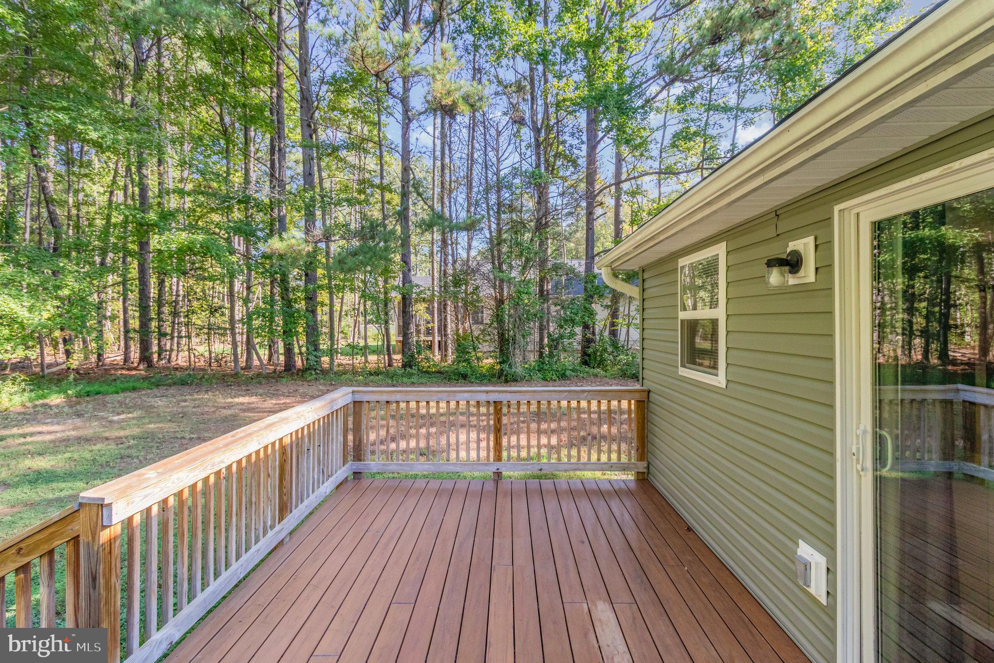 369 Circle Lane Colonial Beach, VA 22443 - Photo 16 of 18 a view of backyard with deck and wooden floor