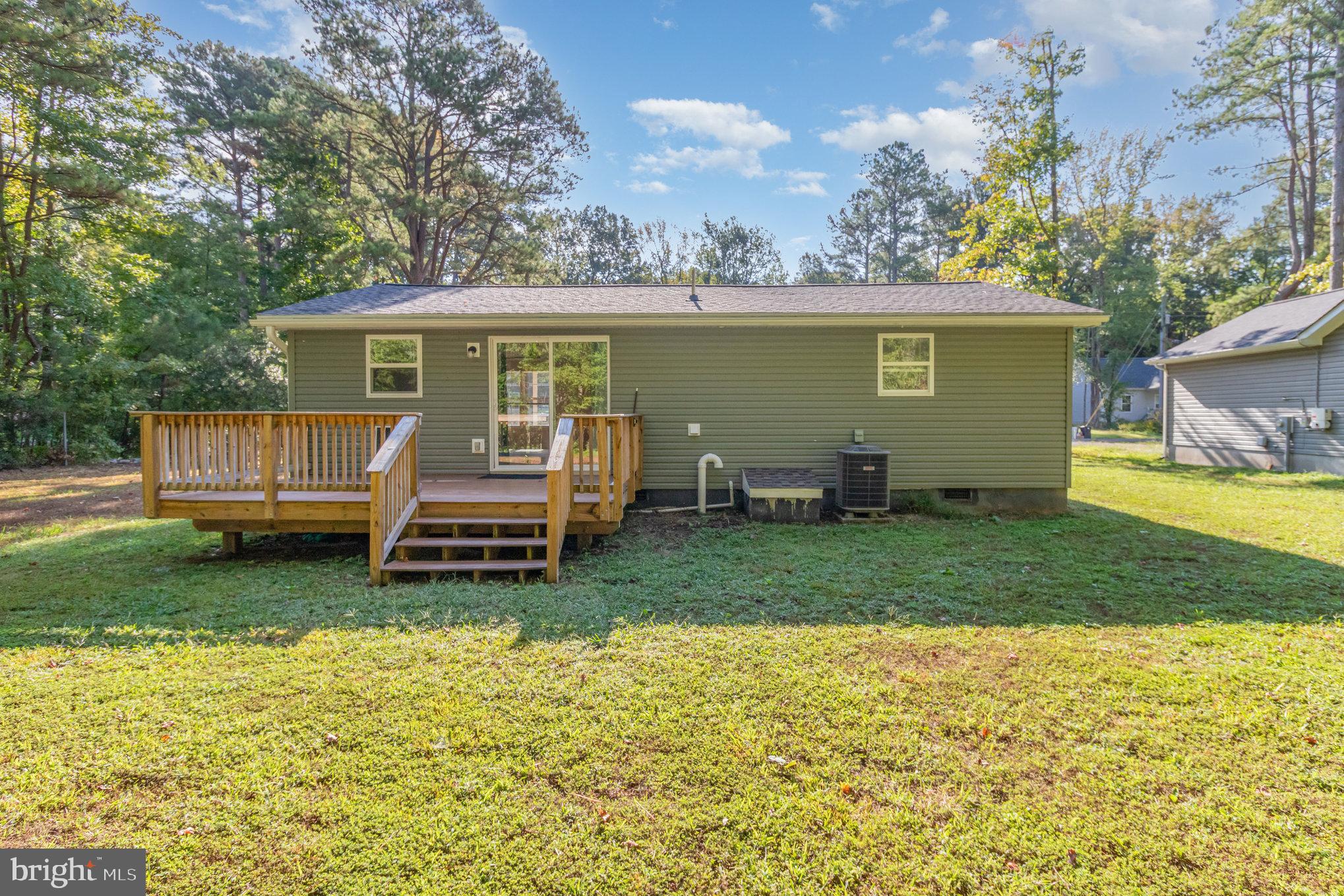 369 Circle Lane Colonial Beach, VA 22443 - Photo 18 of 18 a house view with a garden space