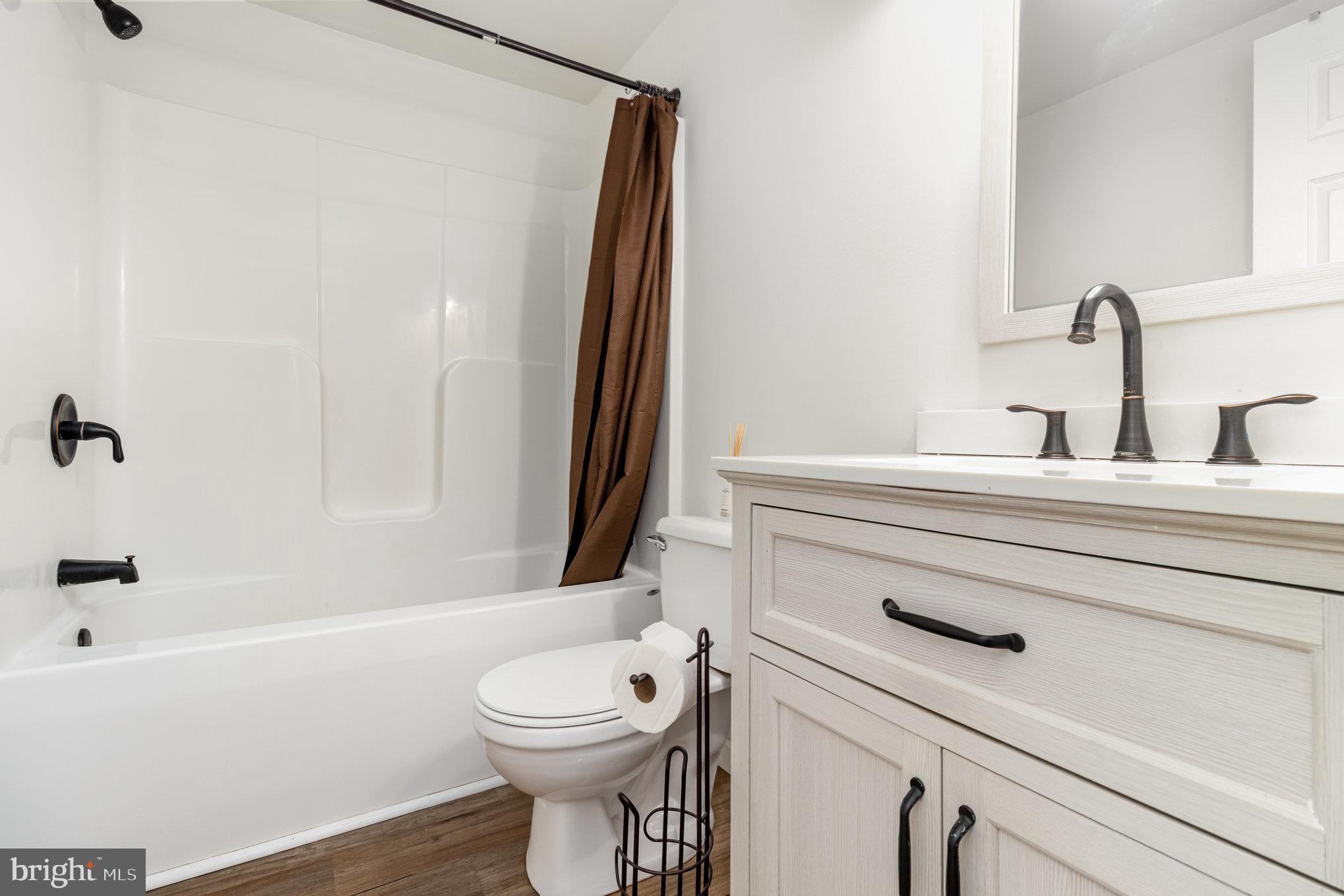 369 Circle Lane Colonial Beach, VA 22443 - Photo 9 of 18 a bathroom with a sink a toilet and shower