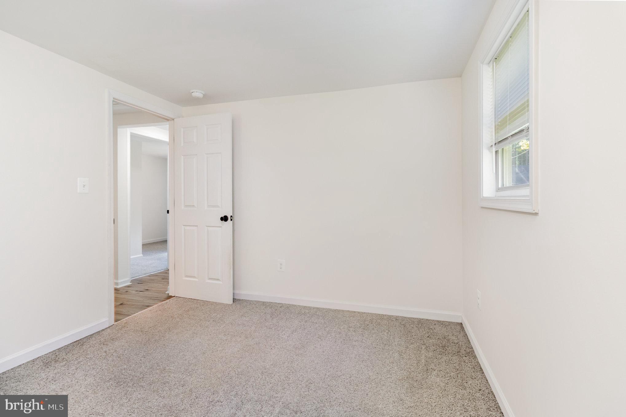 369 Circle Lane Colonial Beach, VA 22443 - Photo 10 of 18 an empty room with windows