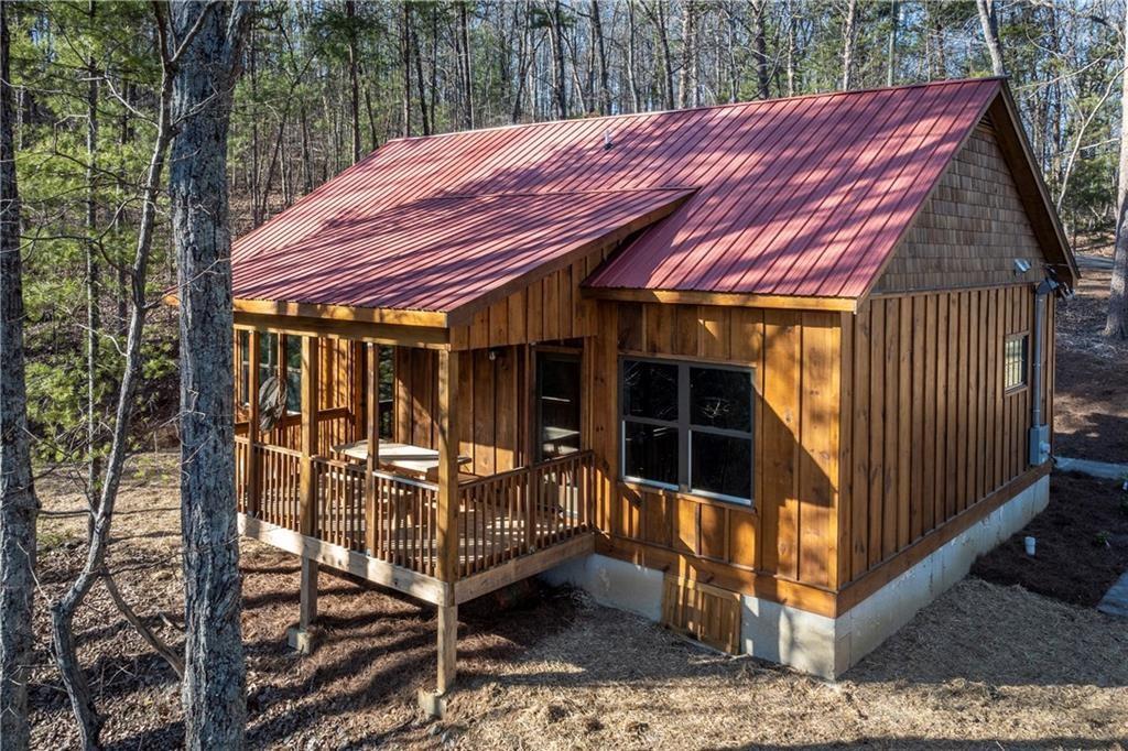 1041 Astro Court Northeast Ranger, GA 30734 - Photo 47 of 52 a view of a backyard with a small cabin