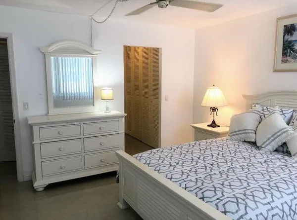 a bedroom with a bed and a closet