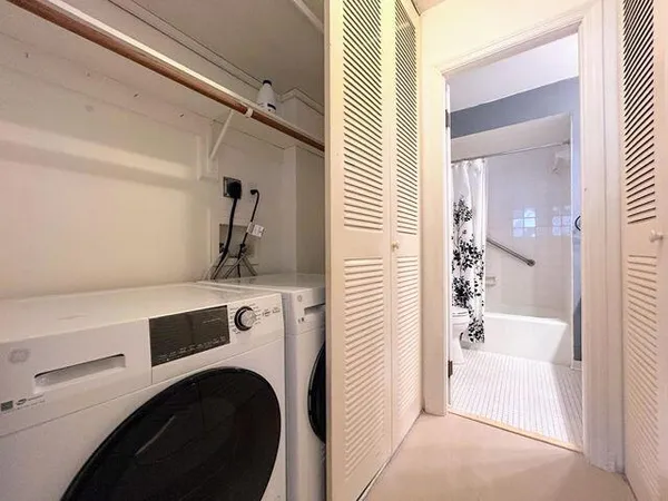 a view of utility room and washer