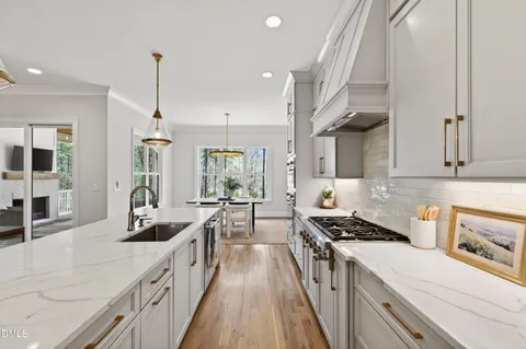a spacious bathroom with a double vanity sink a mirror and a shower