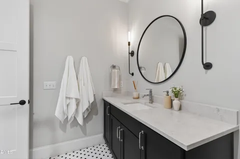 a bathroom with a shower and a sink