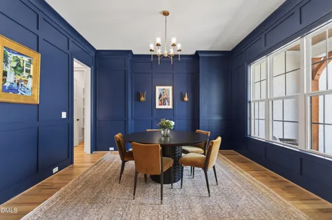 a view of a house with backyard sitting area and garden