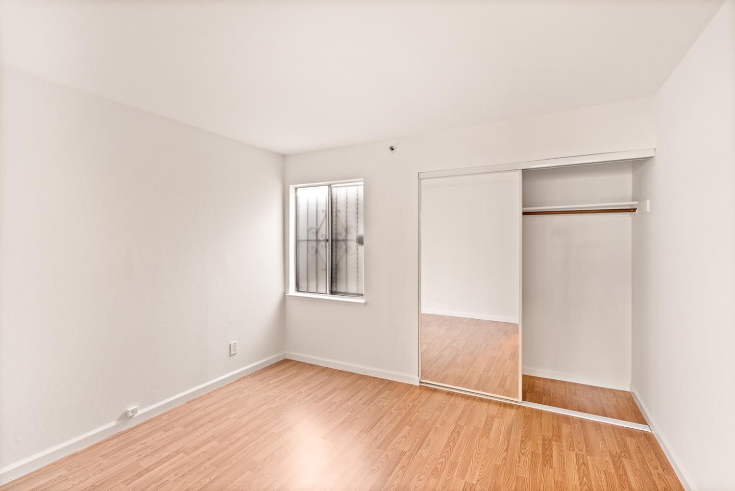 2419 Rowntree Way South San Francisco, CA 94080 - Photo 11 of 28 an empty room with wooden floor and windows