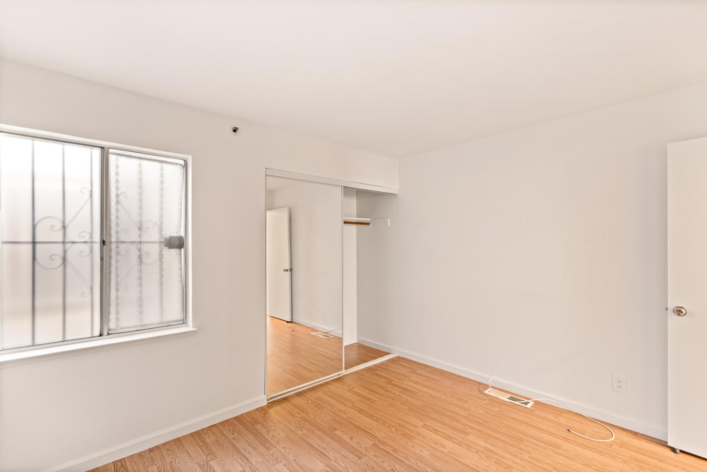2419 Rowntree Way South San Francisco, CA 94080 - Photo 13 of 28 an empty room with wooden floor and windows
