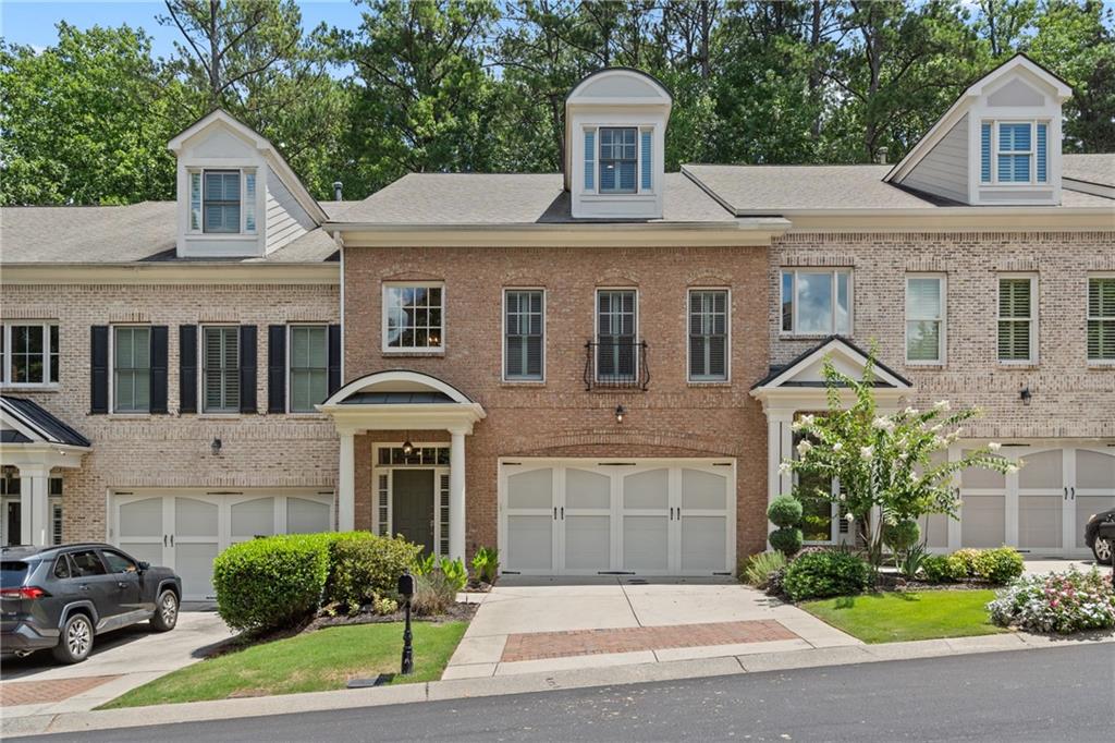 10567 Bent Tree View Duluth, GA 30097 - Photo 1 of 42 a front view of a house with garden