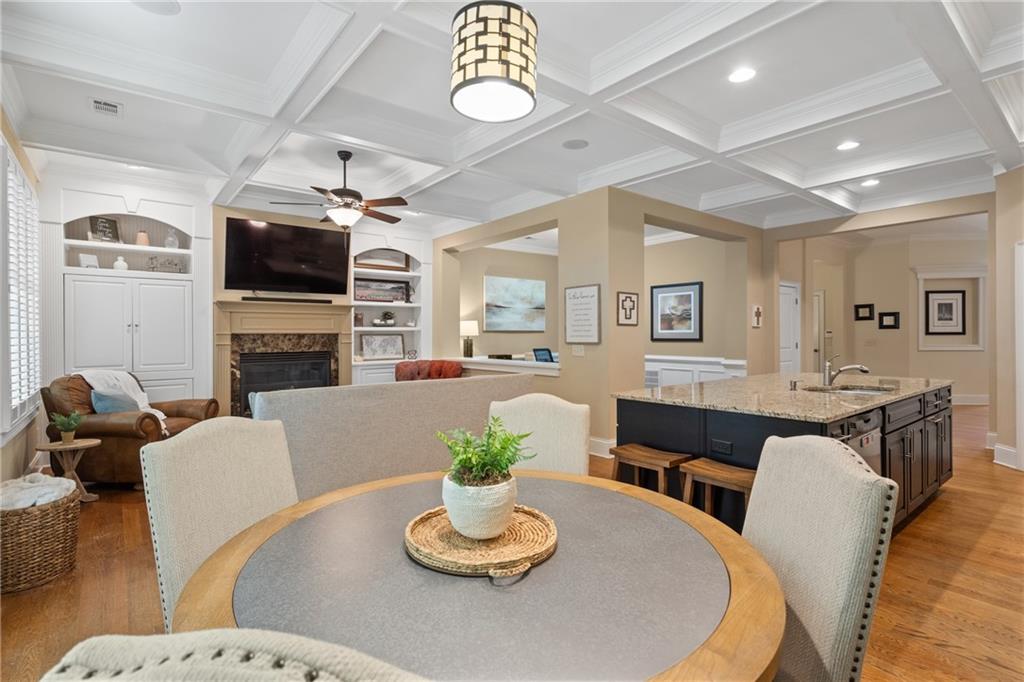 10567 Bent Tree View Duluth, GA 30097 - Photo 17 of 42 a living room with furniture a fireplace and a flat screen tv