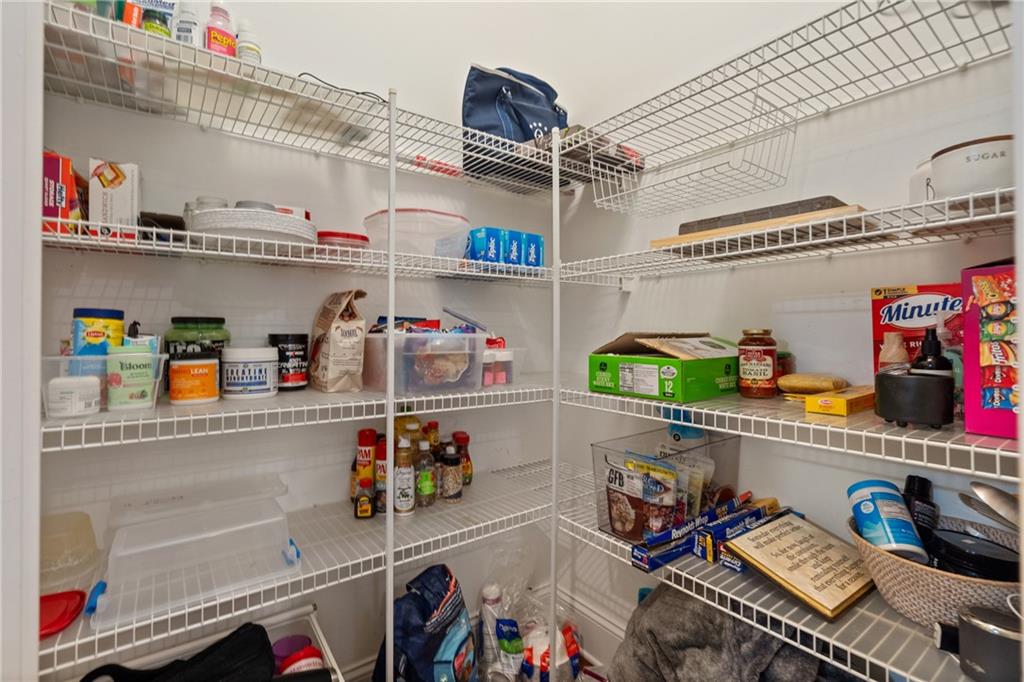 10567 Bent Tree View Duluth, GA 30097 - Photo 18 of 42 a storage room with lots of clutter and cabinets