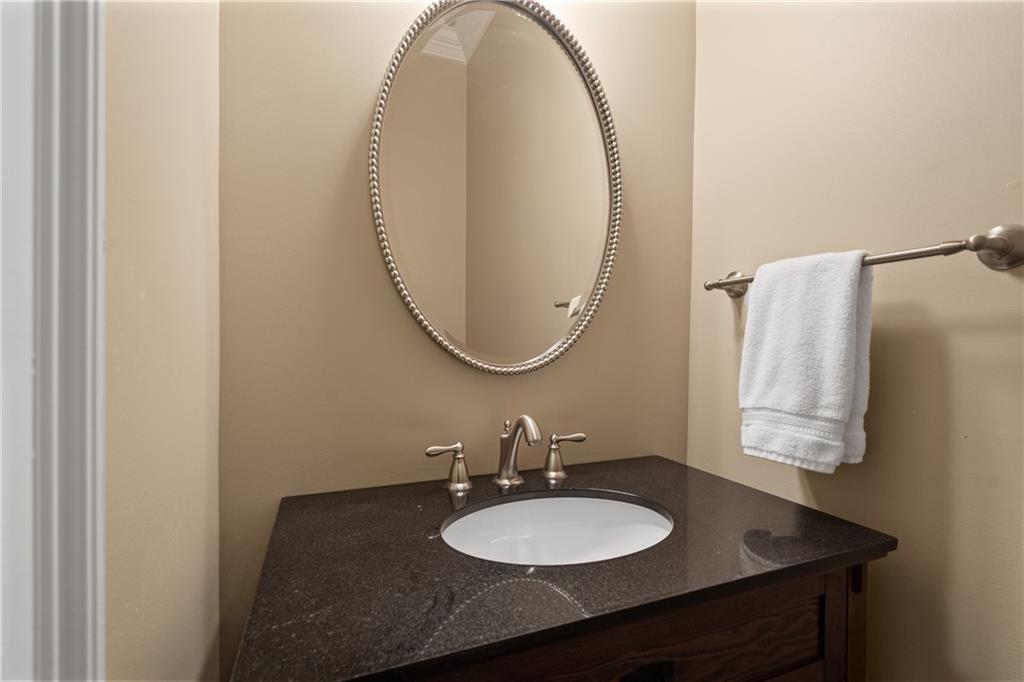 10567 Bent Tree View Duluth, GA 30097 - Photo 19 of 42 a bathroom with a granite countertop sink and a mirror