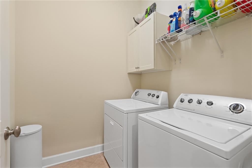 10567 Bent Tree View Duluth, GA 30097 - Photo 20 of 42 a utility room with dryer and washer