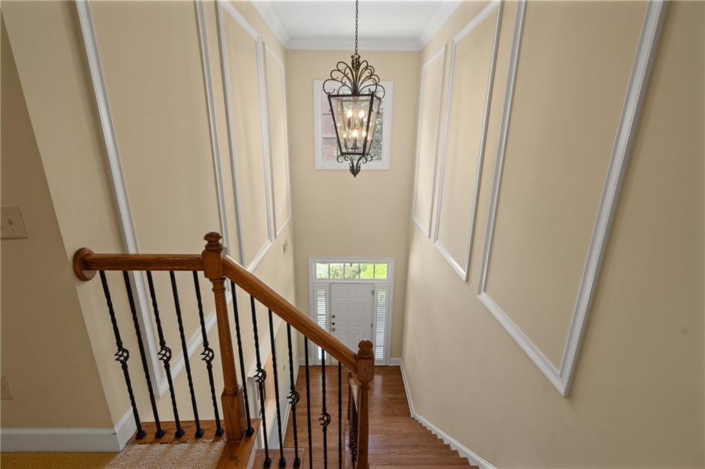 10567 Bent Tree View Duluth, GA 30097 - Photo 21 of 42 a view of a hallway with wooden floor and stairs
