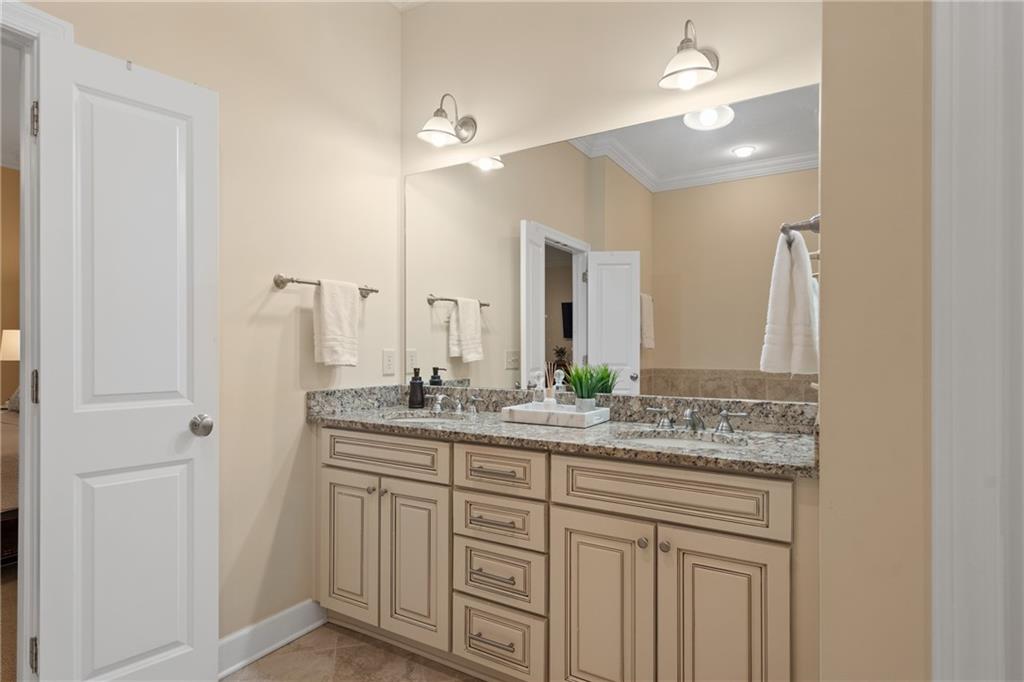 10567 Bent Tree View Duluth, GA 30097 - Photo 27 of 42 a bathroom with a granite countertop sink and a mirror