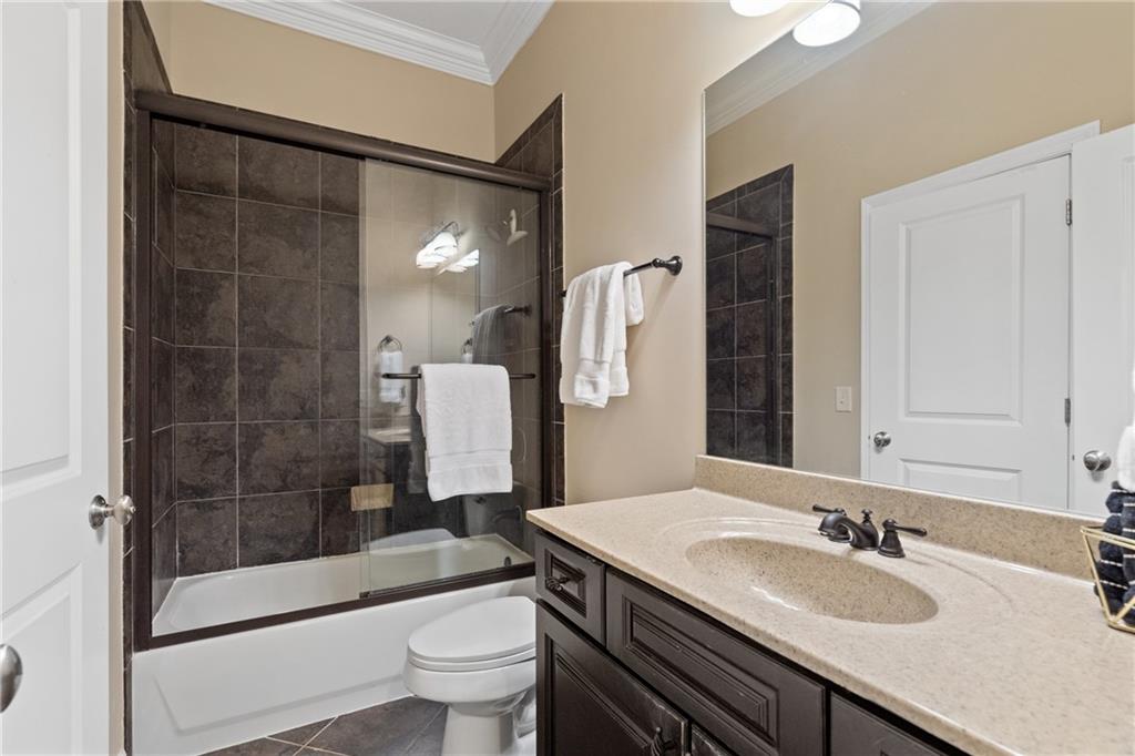 10567 Bent Tree View Duluth, GA 30097 - Photo 35 of 42 a bathroom with a sink a toilet and shower