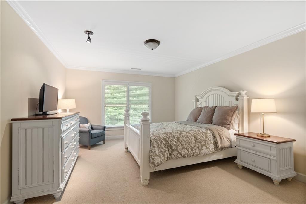 10567 Bent Tree View Duluth, GA 30097 - Photo 36 of 42 a bed room with a bed and a couch