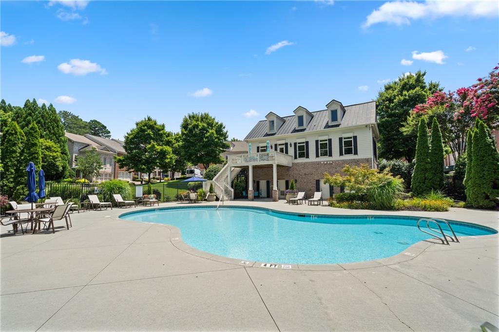 10567 Bent Tree View Duluth, GA 30097 - Photo 42 of 42 a view of a swimming pool with lawn chairs and plants