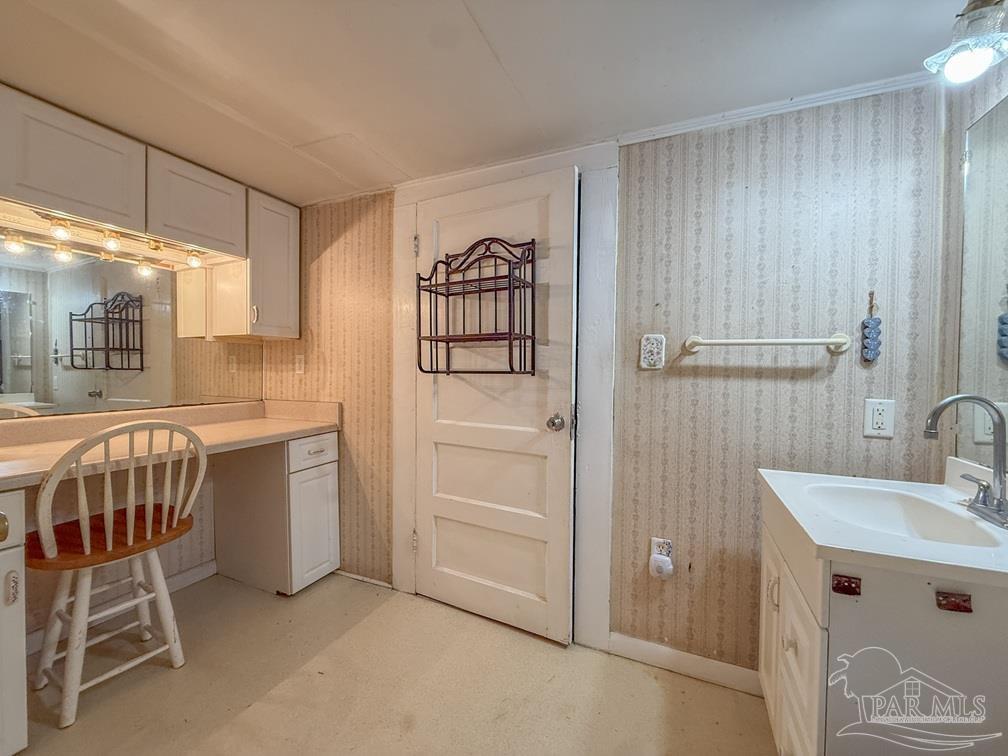 4550 Church Street Bagdad, FL 32583 - Photo 16 of 23 a bathroom with a sink and a mirror