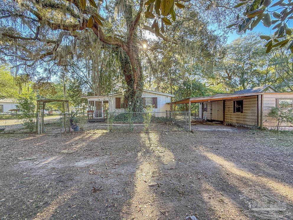 4550 Church Street Bagdad, FL 32583 - Photo 20 of 23 a view of a yard with a tree