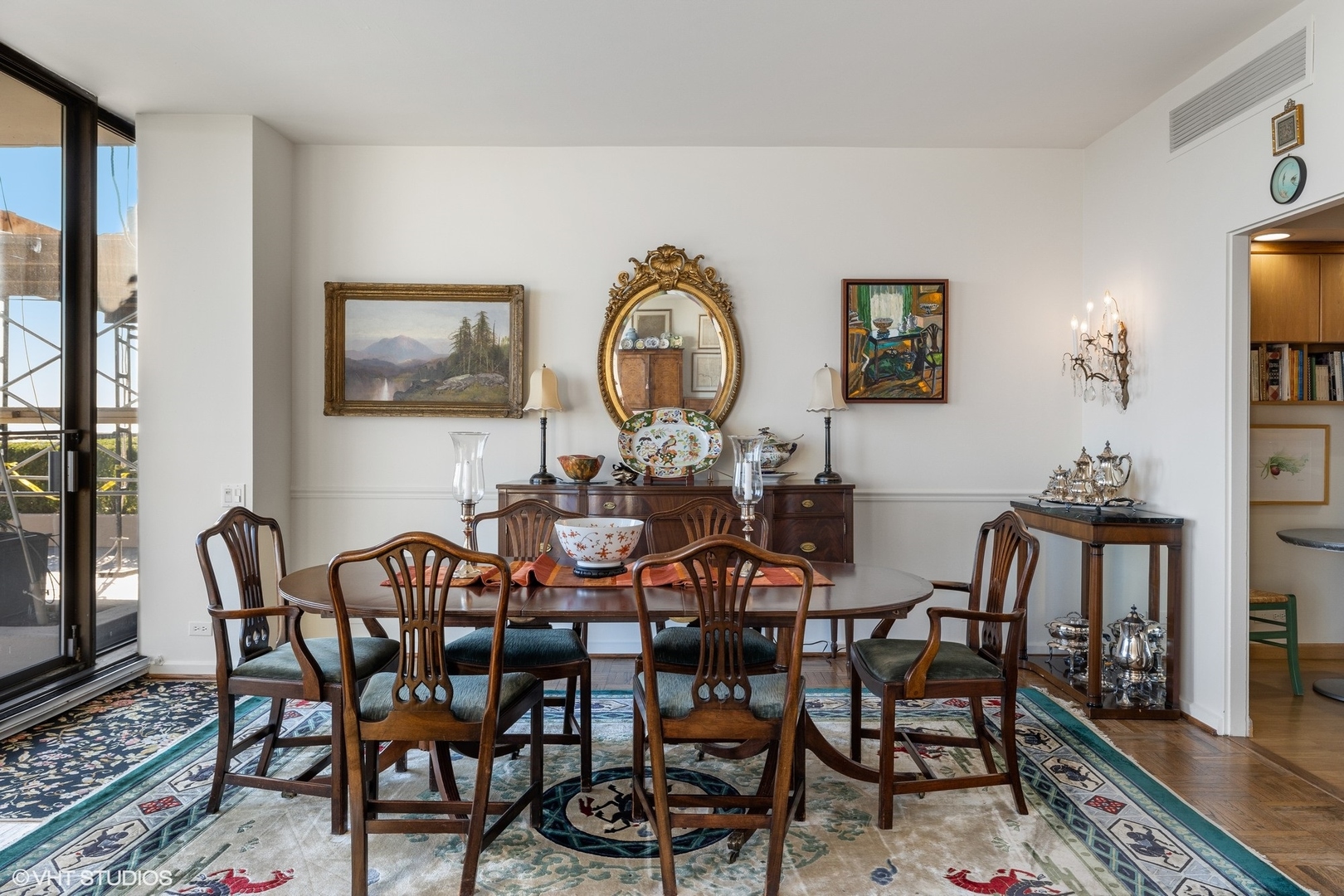 1420 Sheridan Road, Unit 1E Wilmette, IL 60091 - Photo 11 of 47 a view of a dining room with furniture and wooden floor