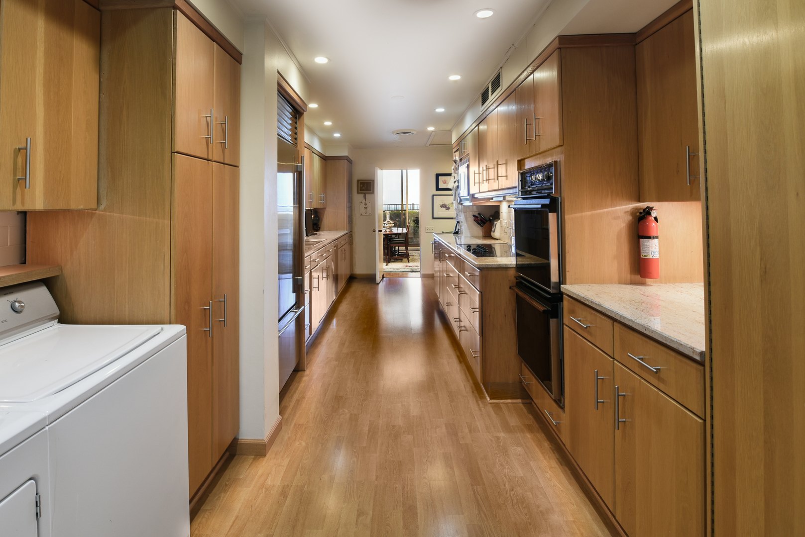 1420 Sheridan Road, Unit 1E Wilmette, IL 60091 - Photo 16 of 47 a view of a kitchen with cabinets and wooden floor