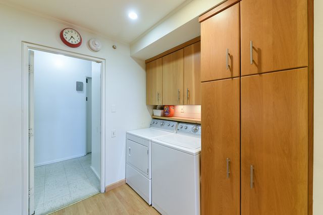a kitchen with a refrigerator and a sink