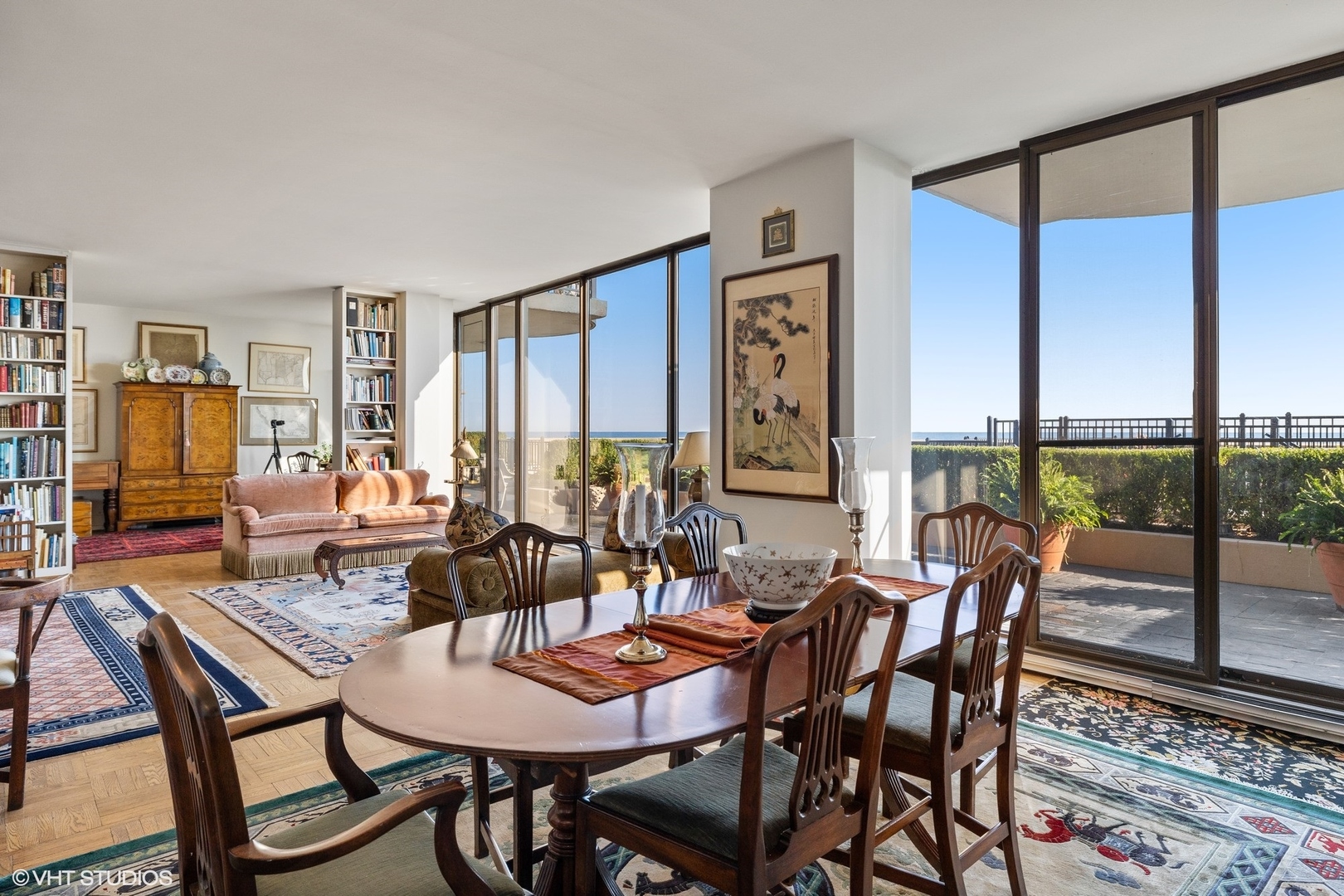 1420 Sheridan Road, Unit 1E Wilmette, IL 60091 - Photo 20 of 47 a dining room with furniture a rug and a large window