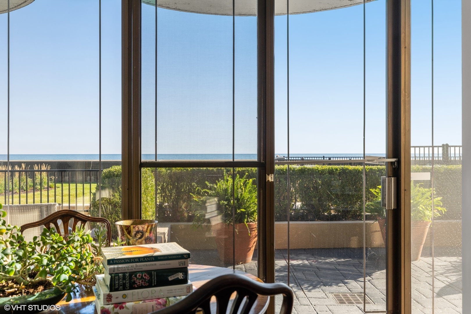 1420 Sheridan Road, Unit 1E Wilmette, IL 60091 - Photo 22 of 47 a view of a balcony with lake view and wooden floor