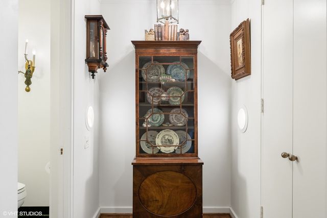 a bedroom with two beds and painting on the wall