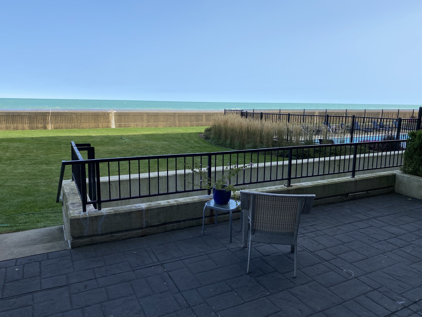 1420 Sheridan Road, Unit 1E Wilmette, IL 60091 - Photo 32 of 47 a view of a roof deck with wooden floor and fence