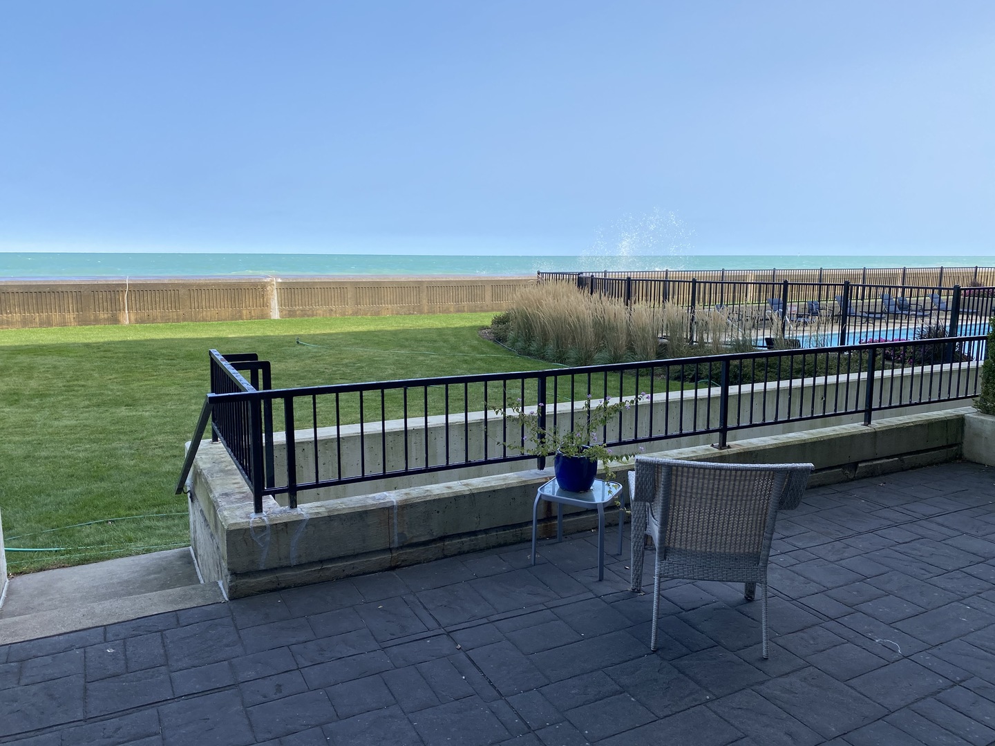 1420 Sheridan Road, Unit 1E Wilmette, IL 60091 - Photo 34 of 47 a view of a bench in the roof deck with a yard