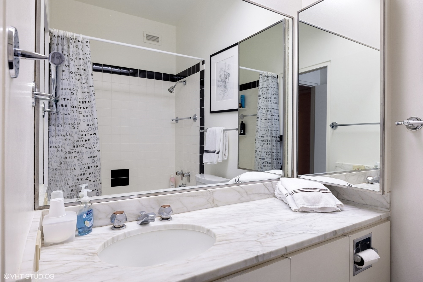 1420 Sheridan Road, Unit 1E Wilmette, IL 60091 - Photo 36 of 47 a bathroom with a granite countertop sink a mirror and shower