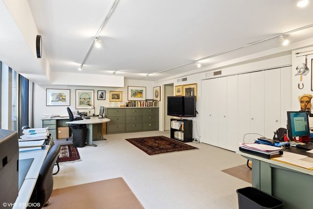 a bathroom with a sink toilet and mirror