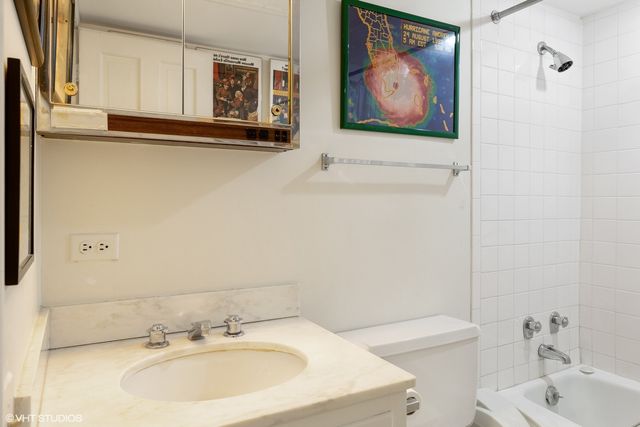 a view of a swimming pool with outdoor seating