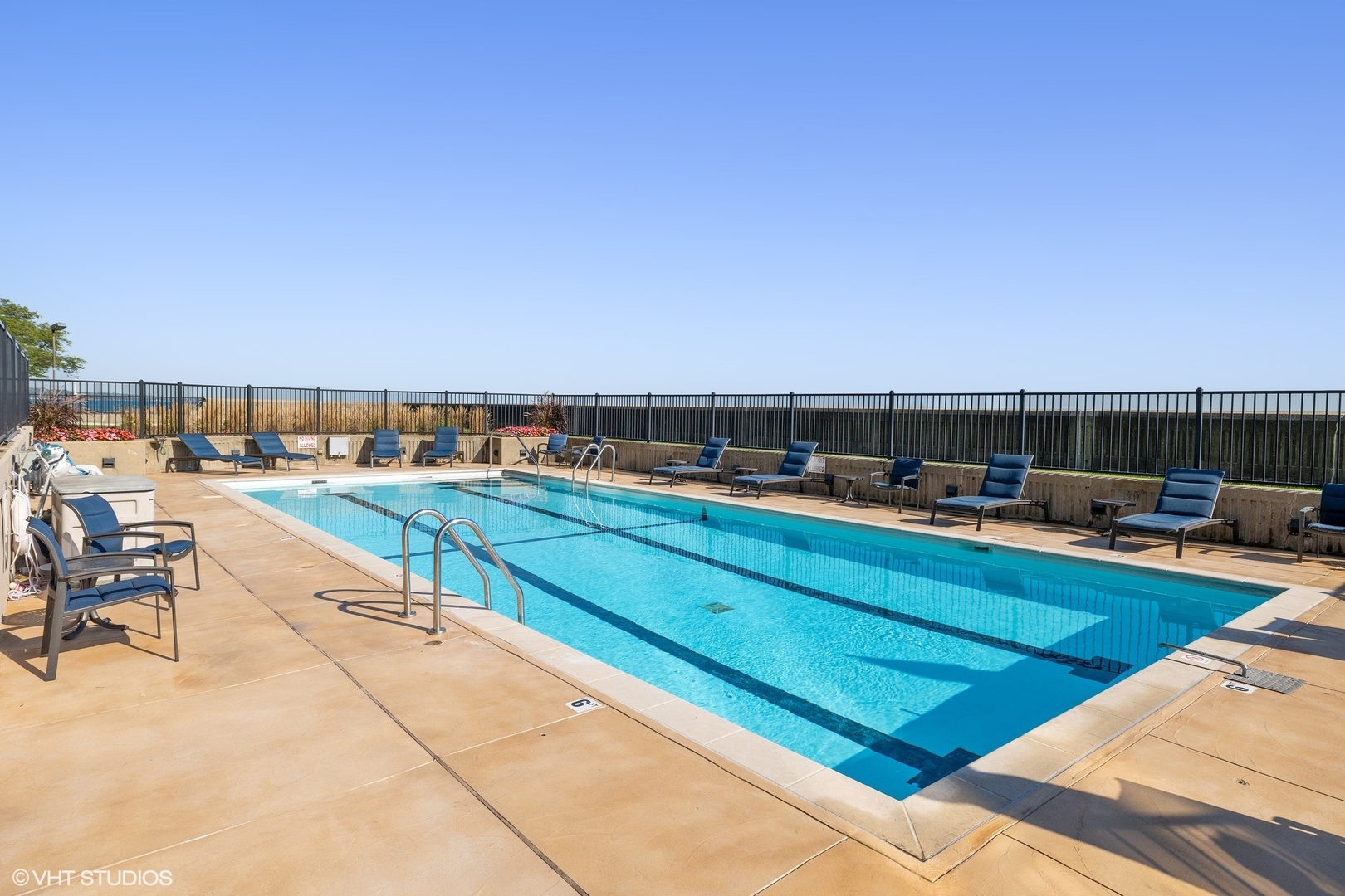 1420 Sheridan Road, Unit 1E Wilmette, IL 60091 - Photo 44 of 47 a view of swimming pool with outdoor seating and yard