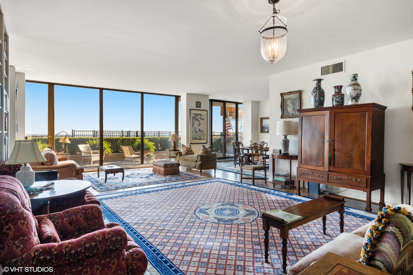 1420 Sheridan Road, Unit 1E Wilmette, IL 60091 - Photo 6 of 47 a living room with furniture a rug and a floor to ceiling window