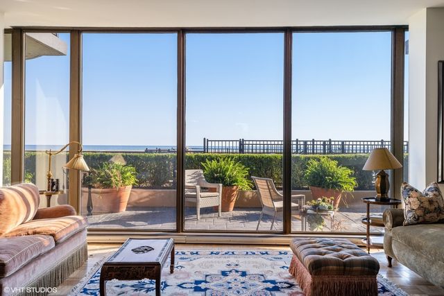 a living room with furniture rug and window