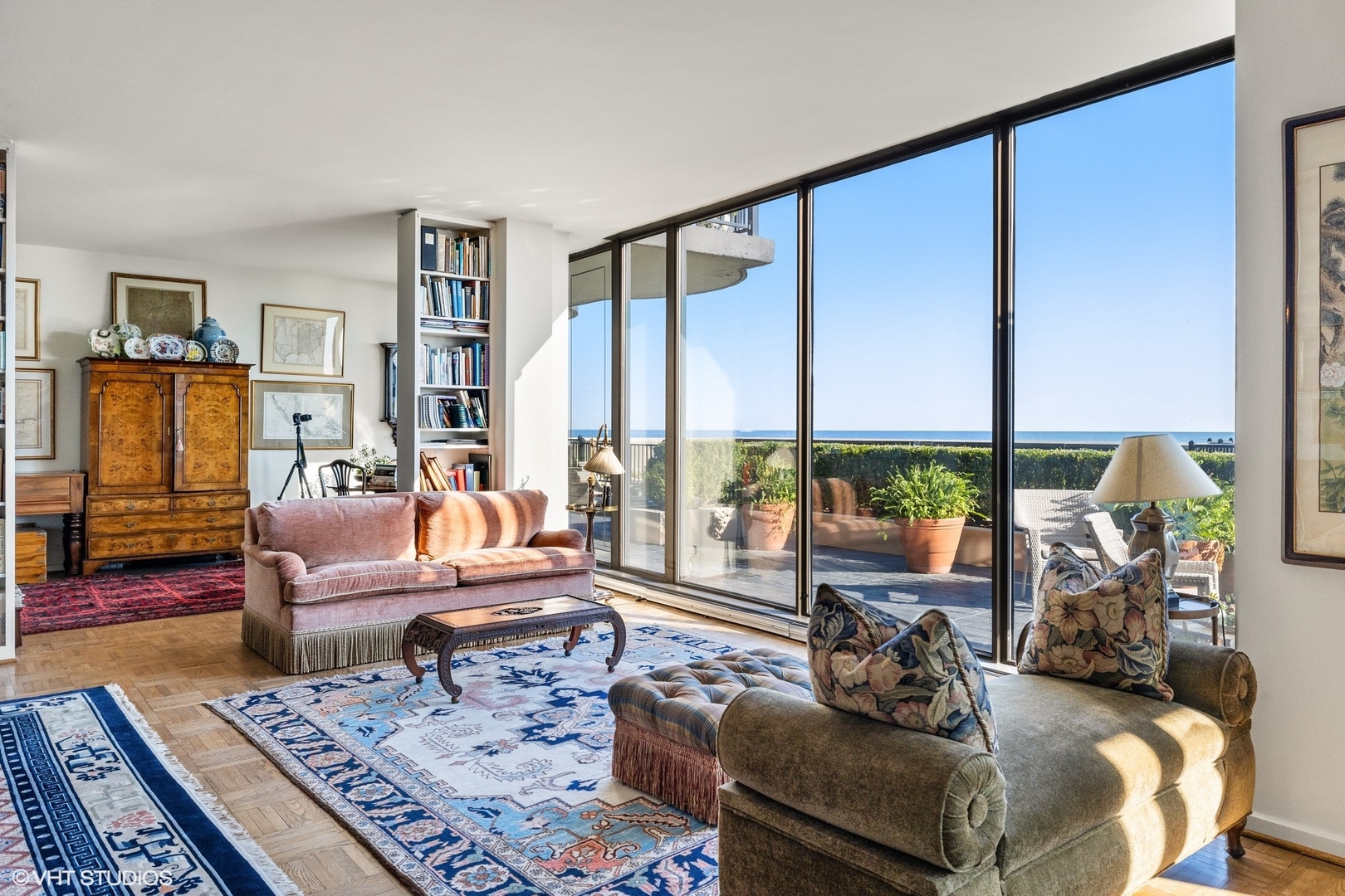 1420 Sheridan Road, Unit 1E Wilmette, IL 60091 - Photo 10 of 47 a living room with furniture large windows and wooden floor